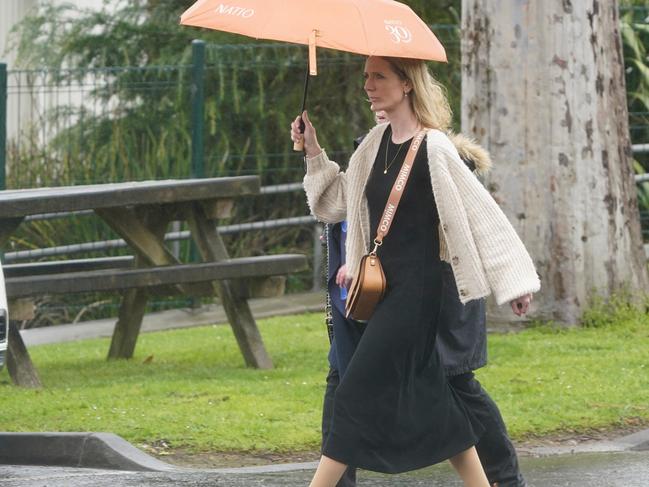 Rain soaked the memorial crowds. Picture: Valeriu Campan