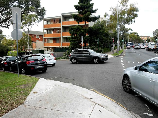 A car turns into Warringah Rd from Spit Rd during morning peak hour to avoid the traffic. Picture: Annika Enderborg