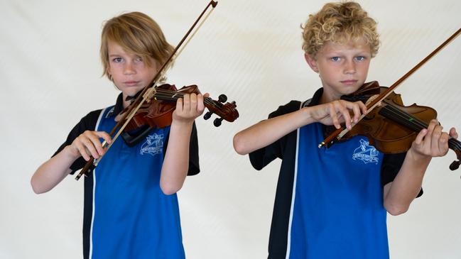 James Bryant and Alex Schuetze from One Mile State School prepare for the small instrumental ensemble strings (primary school) at the Gympie Eisteddfod. August 1, 2023. Picture: Christine Schindler