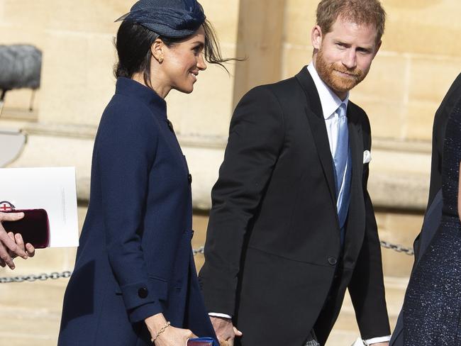 Meghan sparked pregnancy rumours when she appeared at Princess Eugenie’s weddings wearing a loose coat. Picture: EPA/Will Oliver