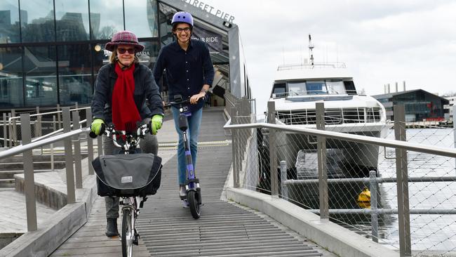 Cyclist Di Elliffe, of Hobart, and e-scooter rider Josh Wise, of Sandy Bay, in front of the River Derwent Ferry. Picture: City of Hobart