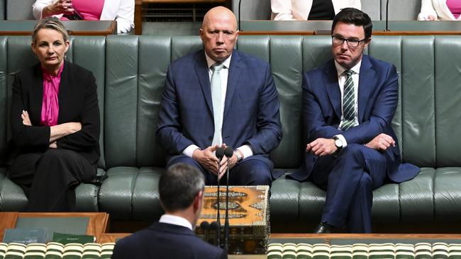 Peter Dutton, flanked by deputy Liberal Party leader Sussan Ley and Nationals leader David Littleproud, listen to the Treasurer on budget night. Picture: AAP