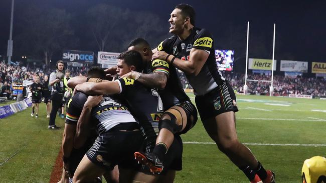 Panthers players celebrate Christian Crichton’s try against the Dragons. Picture. Phil Hillyard