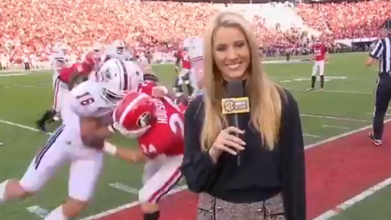ESPN sideline reporter Laura Rutledge hit in college football tackle