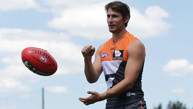 SYDNEY, AUSTRALIA - OCTOBER 16: Ryan Griffen handballs to Callan Ward during a Greater Western Sydney Giants AFL media session at Skoda Stadium on October 16, 2014 in Sydney, Australia. (Photo by Mark Metcalfe/Getty Images)