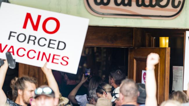 Some of the protesters move inside Bar Wunder on Ruthven St during Saturday’s showing of solidarity with the venue’s management who has been forced to close the business until January 3 or until the venue complies with the health directive. Picture: Kevin Farmer