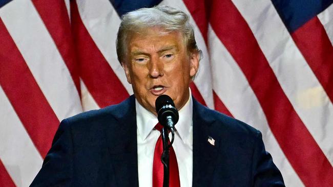 Former US President and Republican presidential candidate Donald Trump speaks during an election night event at the West Palm Beach Convention Center in West Palm Beach, Florida, on November 6, 2024. Donald Trump claimed victory and pledged to "heal" the country on November 6, 2024 as results put him on the verge of beating Kamala Harris in a stunning White House comeback. (Photo by Jim WATSON / AFP)