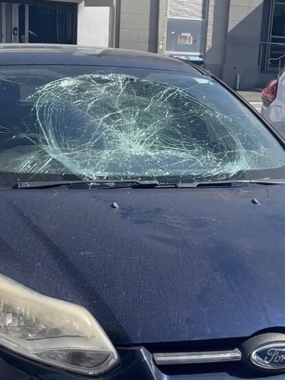 The damage done after he allegedly jumps on a windscreen.