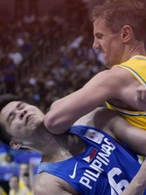 Aussie player Daniel Kickert elbows a Philippines opponent.