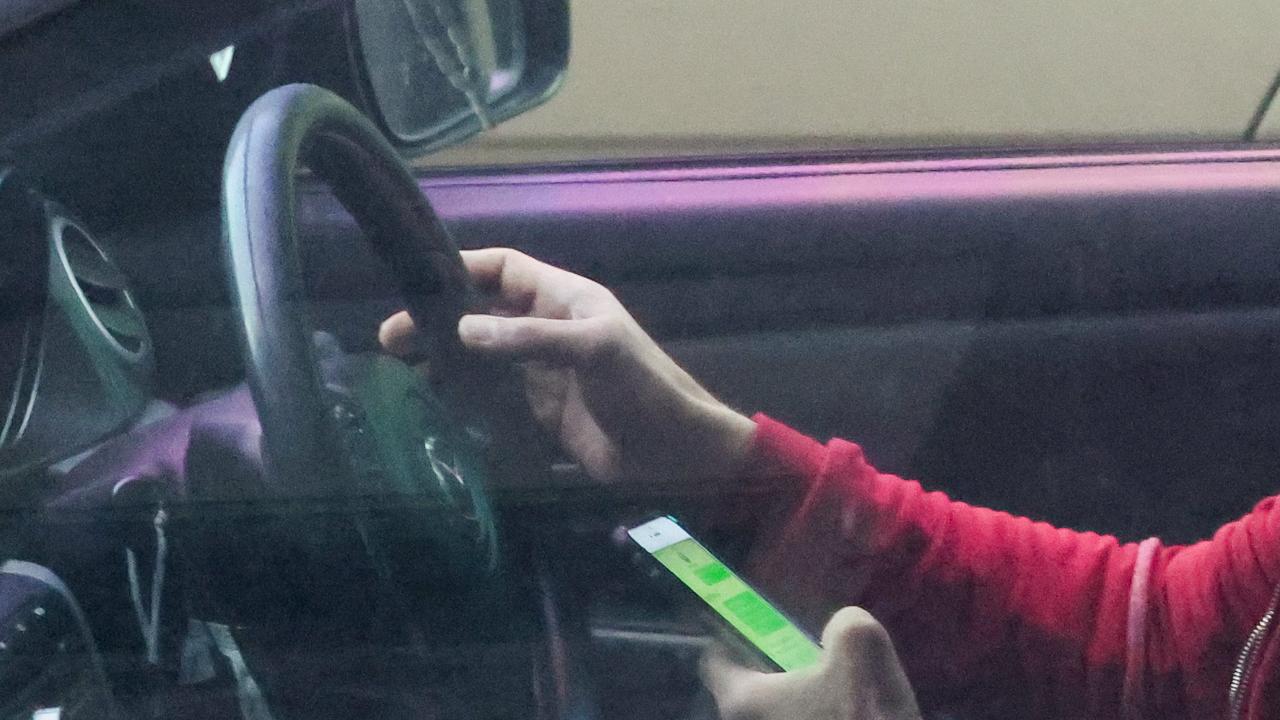 Many states will see drivers hit with the same fines as for when they are caught using their phone. Picture: Brendan Beckett