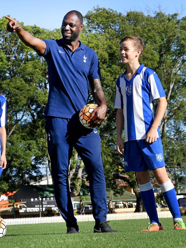 Jamie Waddington three years ago at Nudgee College with former Tottenham Hotspur captain Ledley King. (AAP image, John Gass)