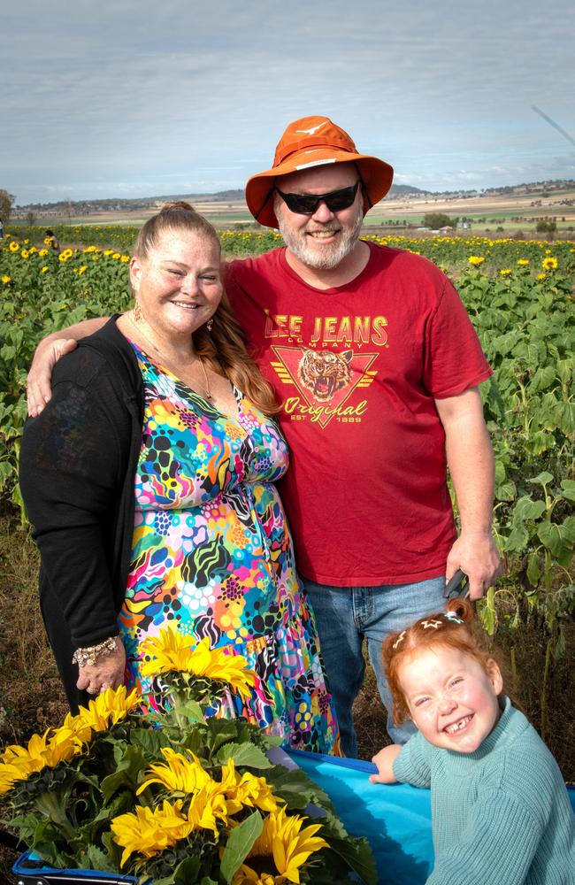 Kelly and Chris Crawford and their daughter Kenzie.Open day at Warraba Sunflowers, Cambooya. Saturday June 29th, 2024
