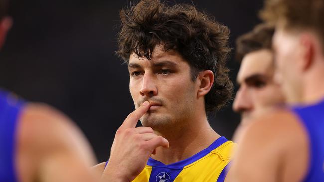 PERTH, AUSTRALIA - APRIL 29: Tom Barrass of the Eagles looks on while Oscar Allen addresses the team before walking from the field at the half time break during the round seven AFL match between the West Coast Eagles and Carlton Blues at Optus Stadium, on April 29, 2023, in Perth, Australia. (Photo by Paul Kane/Getty Images)