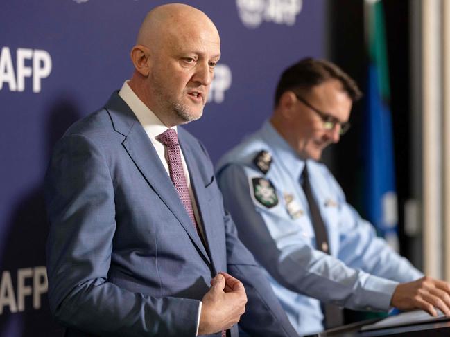 A handout photo taken on July 12, 2024 and received from the Australian Federal Police shows Australiaâs Director-General of Security and head of the Australian Security Intelligence Organisation (ASIO) Mike Burgess (L) speaking next to the Commissioner of the Australian Federal Police Reece Kershaw during a press conference in Canberra. Australian police have charged a married couple with spying for Russia, top officials said on July 12, accusing them of accessing defence-related documents for Moscow. (Photo by Handout / AUSTRALIAN FEDERAL POLICE / AFP) / RESTRICTED TO EDITORIAL USE - MANDATORY CREDIT "AFP PHOTO / AUSTRALIAN FEDERAL POLICE" - NO MARKETING NO ADVERTISING CAMPAIGNS - DISTRIBUTED AS A SERVICE TO CLIENTS