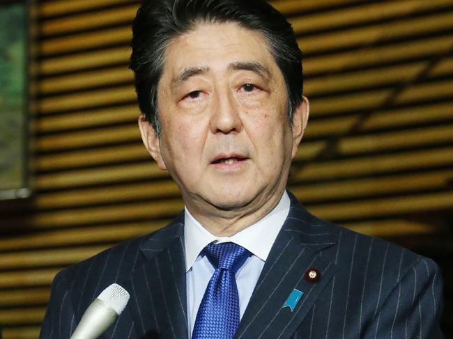 Japan's Prime Minister Shinzo Abe speaks to reporters at his official residence in Tokyo on December 5, 2016. Abe is to become the first Japanese leader to visit Pearl Harbor, announcing on December 5 a trip to Hawaii this month for talks with US President Barack Obama. / AFP PHOTO / JIJI PRESS / JIJI PRESS / Japan OUT
