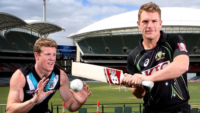 Port Adelaide co-captain Tom Jonas with Australia's Twenty20 captain Aaron Finch at Adelaide Oval. Picture: SARAH REED