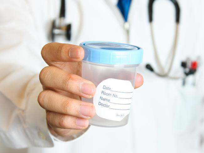 "Doctor handing the patient a sterile sample collection cup.  Shallow depth of field, focused on the hand and cup.  Please visit my lightbox for more similar photos"