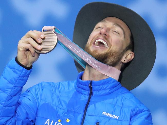 PYEONGCHANG-GUN, SOUTH KOREA - MARCH 16:  Bronze medallist Simon Patmore of Australia celebrates during the medal ceremony for the Men's Snowboard Banked Slalom SB-UL Final on day seven of the PyeongChang 2018 Paralympic Games on March 16, 2018 in Pyeongchang-gun, South Korea.  (Photo by Linnea Rheborg/Getty Images)