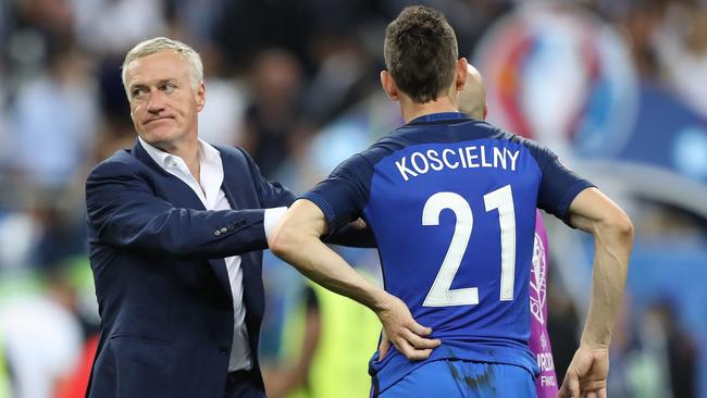 France's coach Didier Deschamps (L) and France's defender Laurent Koscielny.