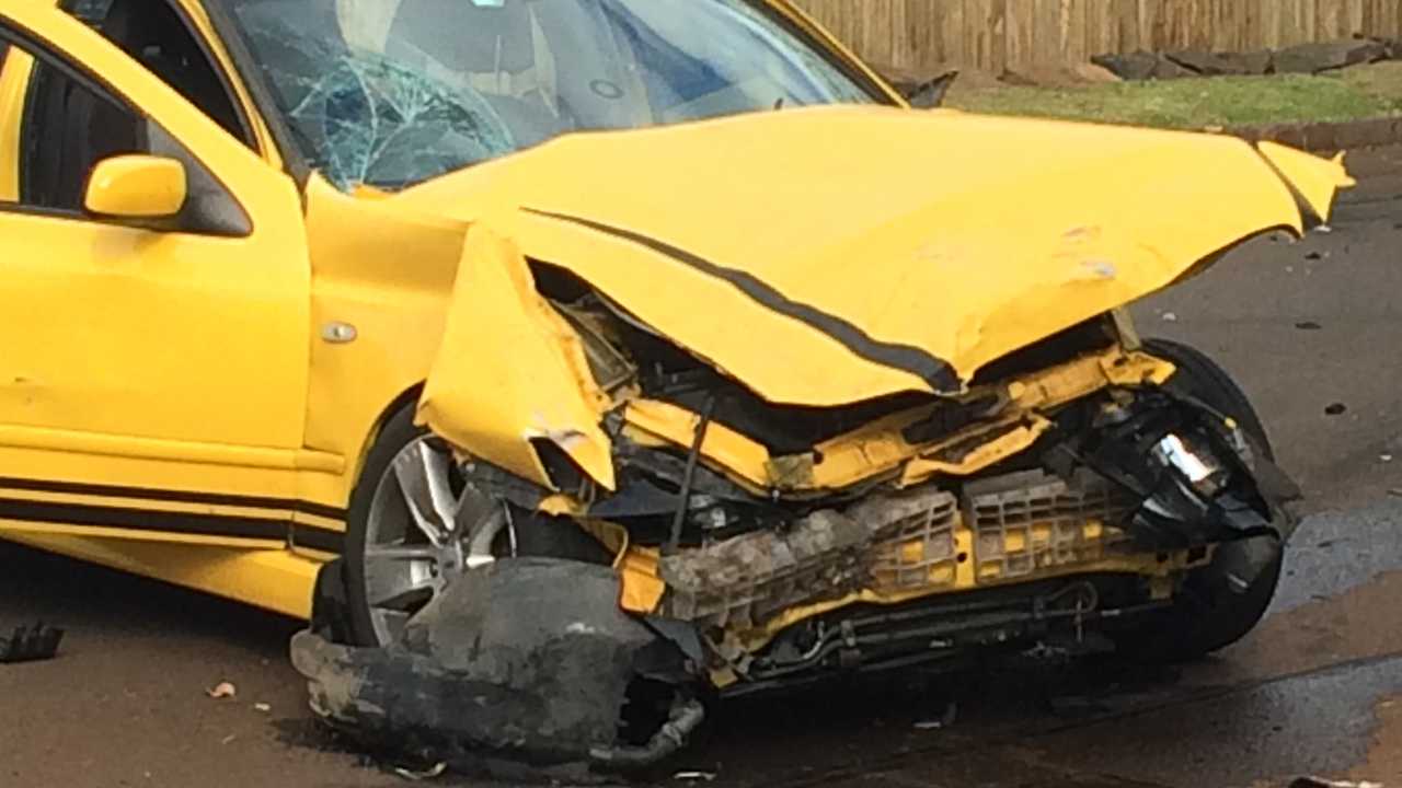 EMERGENCY services are working to free a motorist trapped in a vehicle after a serious crash in the Toowoomba CBD. . Picture: Bev Lacey