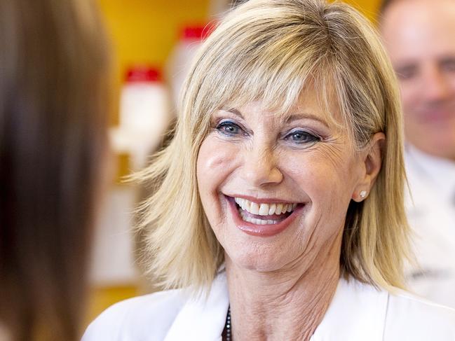 Olivia Newton-John meets with cancer researchers during a tour of the La Trobe Institute for Molecular Science at La Trobe University, Melbourne, Monday, May 14, 2018. Olivia will receive an Honorary Doctorate of Letters at a special graduation ceremony at La Trobe University. (AAP Image/Daniel Pockett) NO ARCHIVING