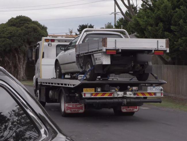 A ute is towed during a raid in Melbourne's south on Tuesday. Picture: Victoria Police