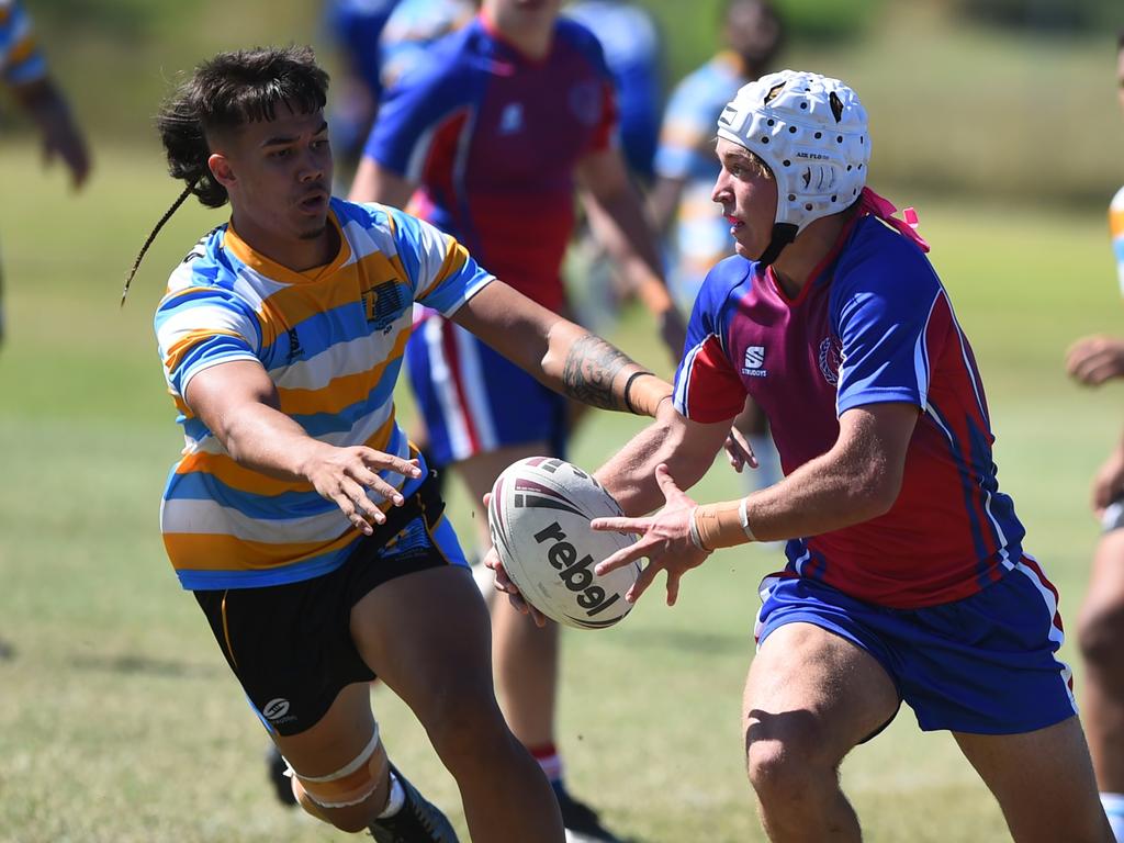 Boys Rugby League State Championship held at Northern Division, Brothers Leagues ground, Townsville. 16-18 years. Peninsula (stripe) v Darling Downs (blue/purple). Braithen Scott of St Mary's College, Toowoomba.