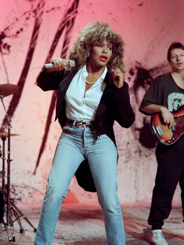 US singer Tina Turner performs during the TV show "Champs-ElysÃ©es" on Channel Antenne 2 on November 24, 1989. Rock legend Tina Turner, the growling songstress who electrified audiences from the 1960s and went on to release hit records across five decades, has died at the age of 83, a statement announced on May 24, 2023. "It is with great sadness that we announce the passing of Tina Turner," read the statement on the official Instagram page of the eight-time Grammy winner. (Photo by Jean-Pierre MULLER / AFP)