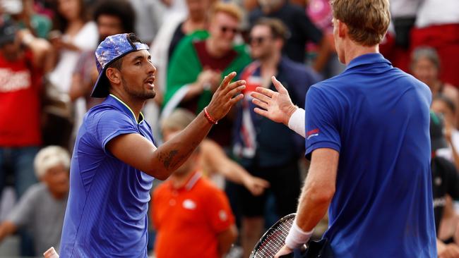 PARIS, FRANCE — JUNE 01: (L-R) The defeated Nick Kyrgios of Australia shakes hands with Kevin Anderson of the United States cfollowing their men's singles second round match against on day five of the 2017 French Open at Roland Garros on June 1, 2017 in Paris, France. (Photo by Adam Pretty/Getty Images)