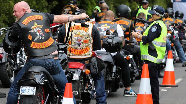 Police keep a watchful eye on the Bandidos' motorcycle gang as they arrive in Burnie in Tasmania's North-West. Picture: CHRIS KIDD