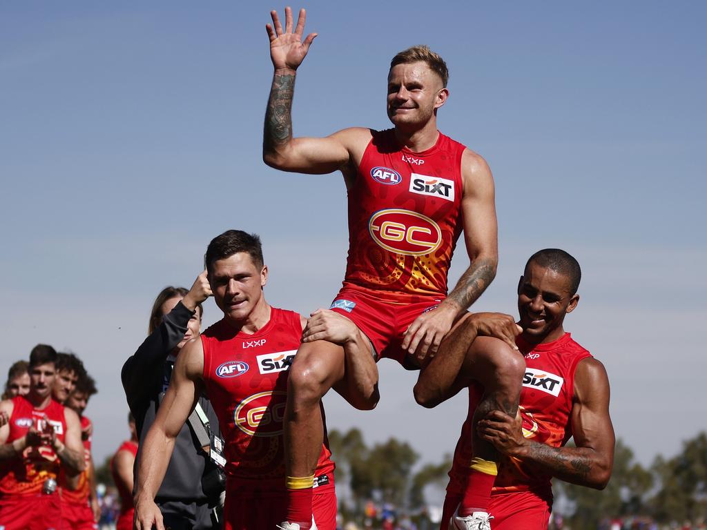 Brandon Ellis of the Suns is chaired off the field after playing his 250th game during the round two AFL match between Western Bulldogs and Gold Coast Suns at Mars Stadium, on March 24, 2024, in Ballarat, Australia. (Photo by Daniel Pockett/Getty Images)