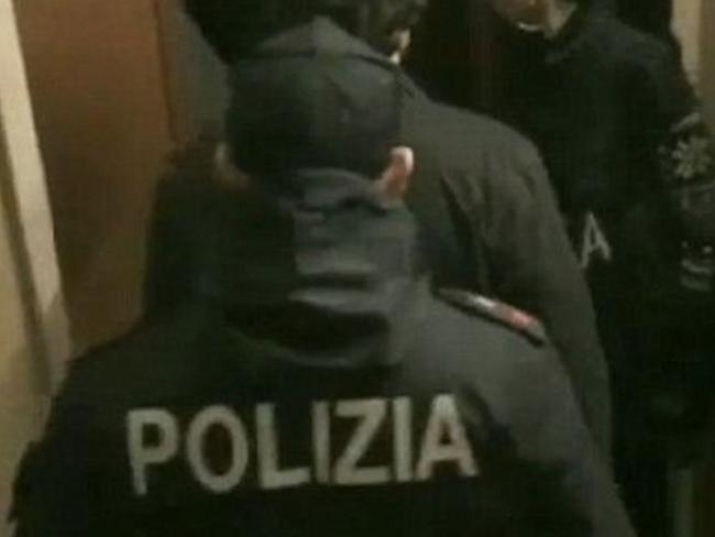 Stills from Italian state video of police arresting 163 alleged members of Notorious Italian Mafia Gang 'Ndrangheta