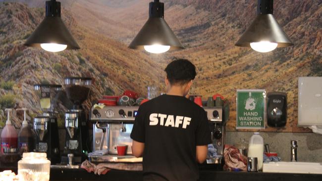 An Alice Springs Brewing Co employee makes a coffee at the namesake pub in Alice Springs, August 2024. Picture: Gera Kazakov