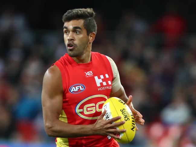 Jack Martin of the Suns runs the ball during the round eight AFL match between the Gold Coast Suns and the Melbourne Demons at Metricon Stadium on May 11, 2019 in Gold Coast, Australia. (Photo by Chris Hyde/Getty Images)