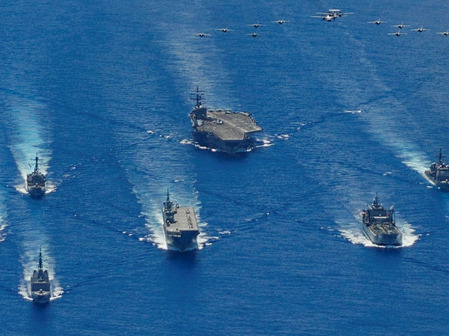 HMA Ships Canberra, Hobart, Stuart, Arunta and Sirius taking part in a trilateral passage in the Philippine Sea with US Navy ships, USS Ronald Reagan, Antietam and Mustin and the Japanese Maritime Self-Defense Force’s Akizuki-class destroyer JS Teruzuki.