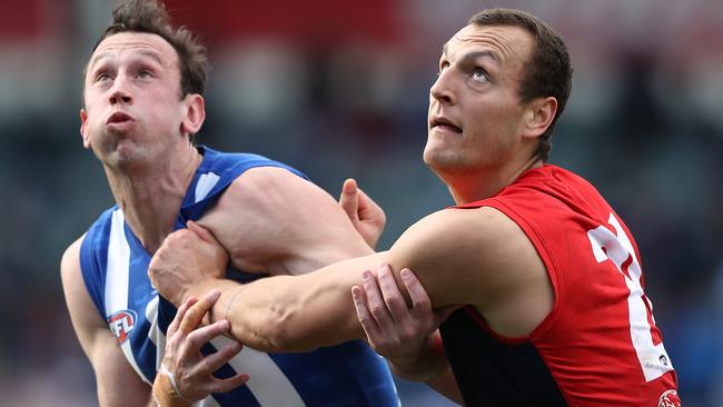 Braydon Preuss goes up against former teammate Todd Goldstein at a ruck contest last season. Picture: Getty Images