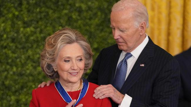 Hillary Clinton receives the Medal of Freedom from United States President Joe Biden during a ceremony at the White House in Washington, DC, January 4, 2025. (Photo by Chris Kleponis / AFP)