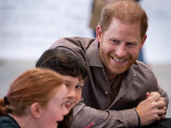 The royal beamed as he chatted with children at the schools launch. Picture: Getty Images