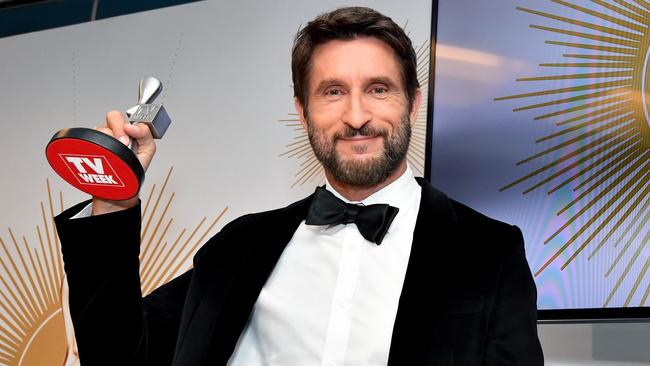 Jonathan LaPaglia of Australian Survivor: Champions Vs Contenders poses with the Logie for Most Outstanding Reality Program during the 2019 Logie Awards.