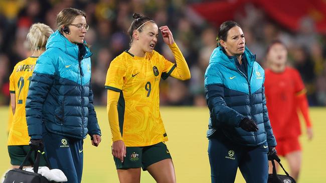 ADELAIDE, AUSTRALIA - MAY 31: Caitlin Foord of Australia taken from the pitch by medical staff during the international friendly match between Australia Matildas and China PR at Adelaide Oval on May 31, 2024 in Adelaide, Australia. (Photo by Sarah Reed/Getty Images)