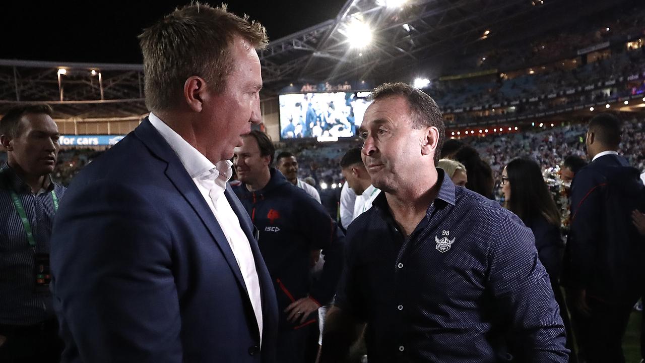 Trent Robinson, coach of the Roosters, is congratulated by Ricky Stuart after last year’s grand final