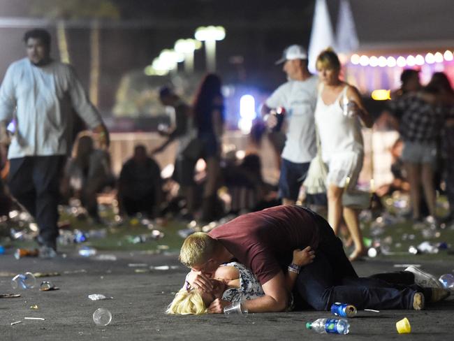 People lie on the ground at the Route 91 Harvest country music festival after gun fire was heard. Picture: Getty