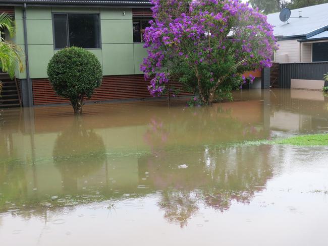 Flooding on Geoffrey Rd, Chittaway, after torrential rain over the weekend. Picture: Richard Noone