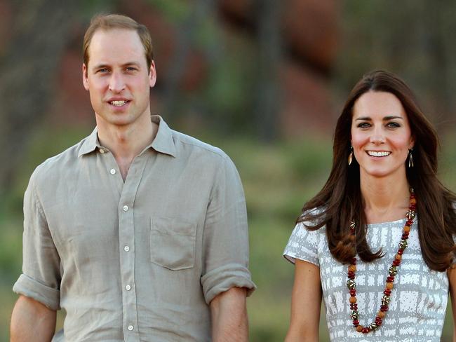 AYERS ROCK, AUSTRALIA - APRIL 22:  Catherine, Duchess of Cambridge and Prince William, Duke of Cambridge walk down Kuniya Walk at the base of Uluru on April 22, 2014 in Ayers Rock, Australia. The Duke and Duchess of Cambridge are on a three-week tour of Australia and New Zealand, the first official trip overseas with their son, Prince George of Cambridge.  (Photo by Scott Barbour/Getty Images)