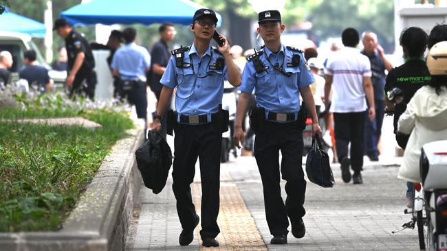 Police patrol outside the Jingxi Hotel, where China’s are conducting the Third Plenum in Beijing this week. Picture: AFP