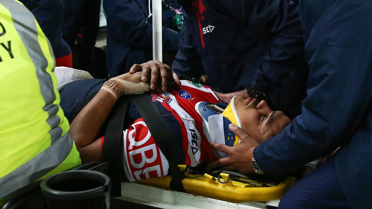 Latrell Mitchell of the Roosters is stretchered off the field after suffering a neck injury against the Panthers.