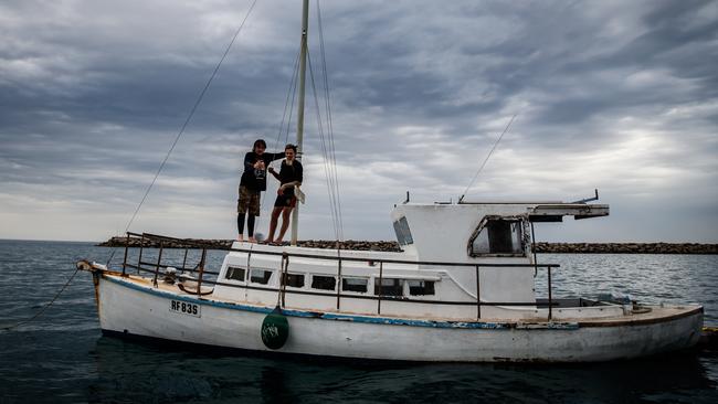 Tony Higgins on his boat with his mate Derek Robinson earlier this month. Picture Matt Turner.