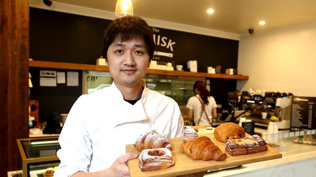 Pastry chef Justin Yu is the owner of The Whisk at Upper Mount Gravatt, his pastries are so popular he usually sells out before lunchtime. Picture: AAP/David Clark