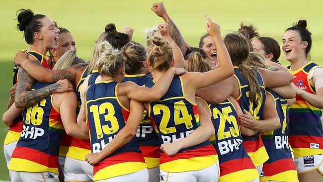 The Crows belt out their team song after their dominant win.