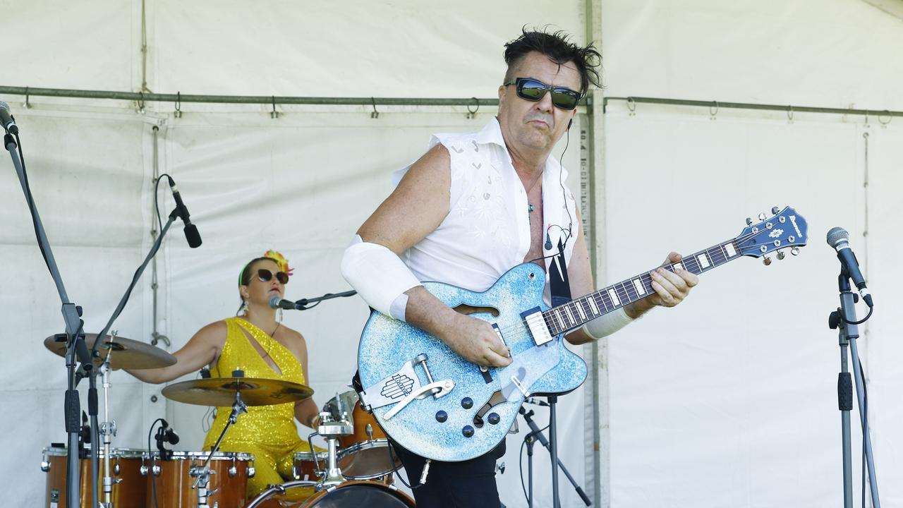 Katie Richards and Gumpy Savidas perform onstage at the Little Day Out family day, held at the Holloways Beach Sports Oval and raising funds for the Holloways Hub. Picture: Brendan Radke